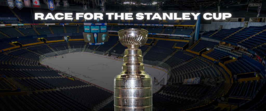 The Stanley Cup, in front of an empty hockey rink.